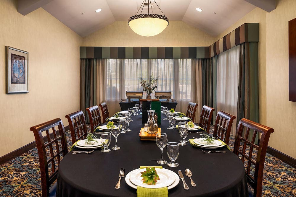 fine dining set up like a board room with one long main table, chairs on either side.